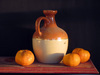 jug and tangerines