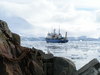 small boat in a large sea